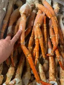gigantic crab legs with a finger for comparison