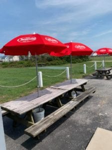 JImmy's seafood buffet exterior picnic tables with cheerwine umbrellas